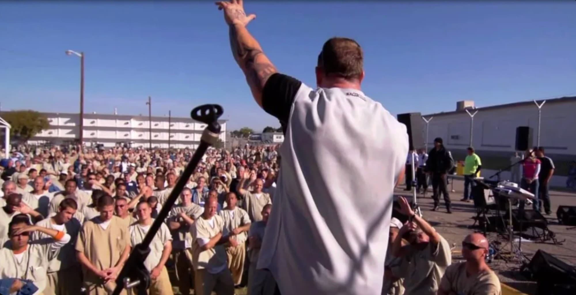 Duché Bradley speaking to a large outdoor crowd