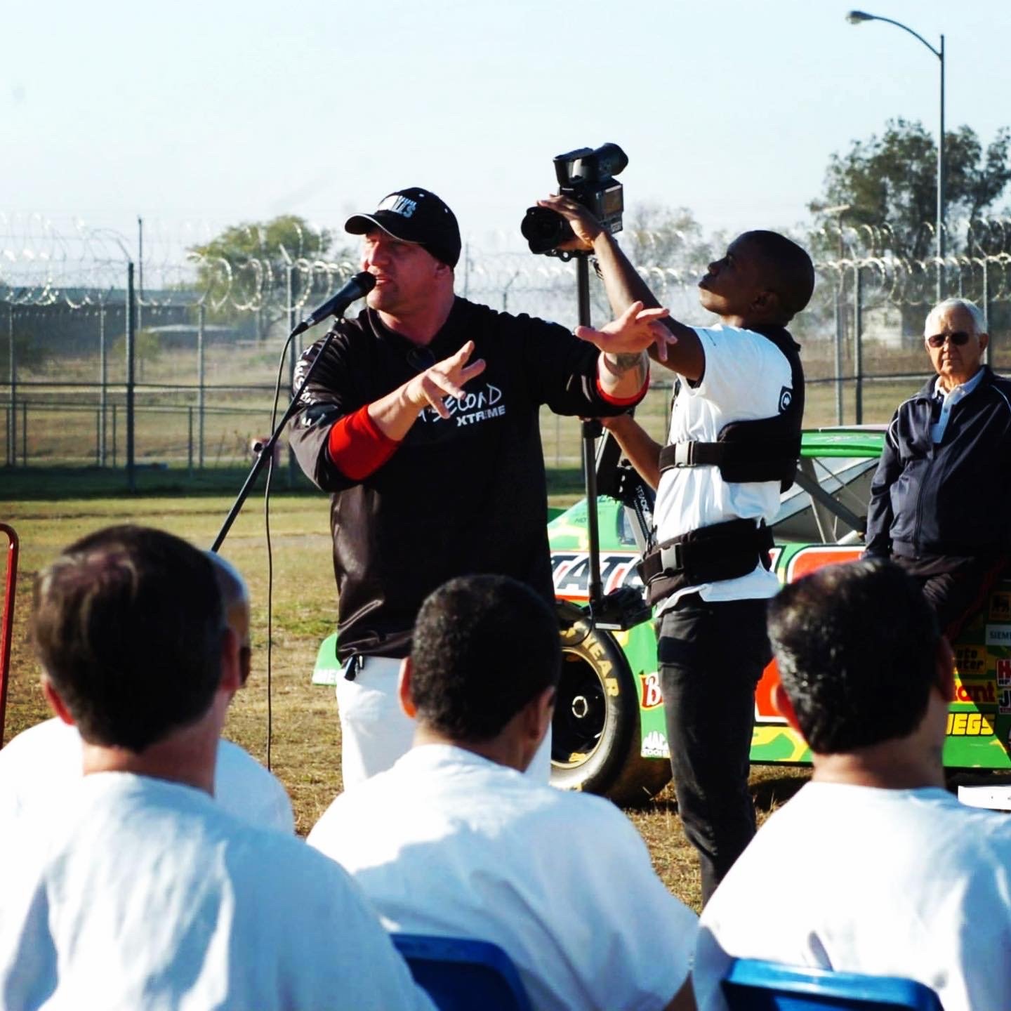 Duché Bradley speaking at a prison yard event